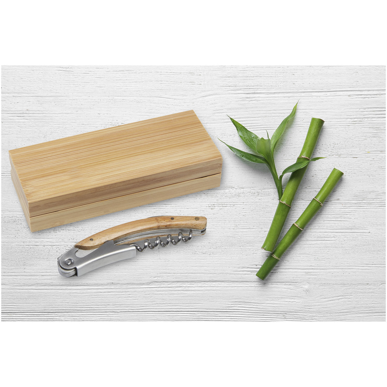 Green,Bamboo,Stems,On,White,Wooden,Background,,Top,View.,Space