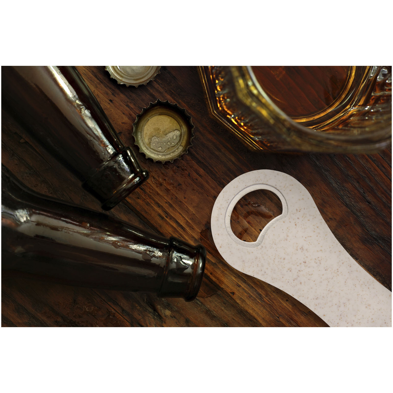 Top,View,Of,Near,Empty,Beer,Glass,With,Bottle,Caps