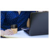 Serious businessman in speckled shirt, working with laptop remotely.